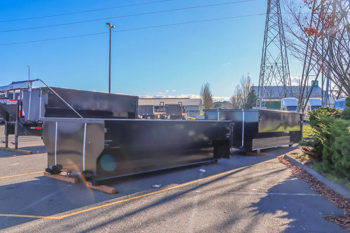Roll-off dumpster ready for waste disposal at job site for Concrete Dumpster Rental in Otsego